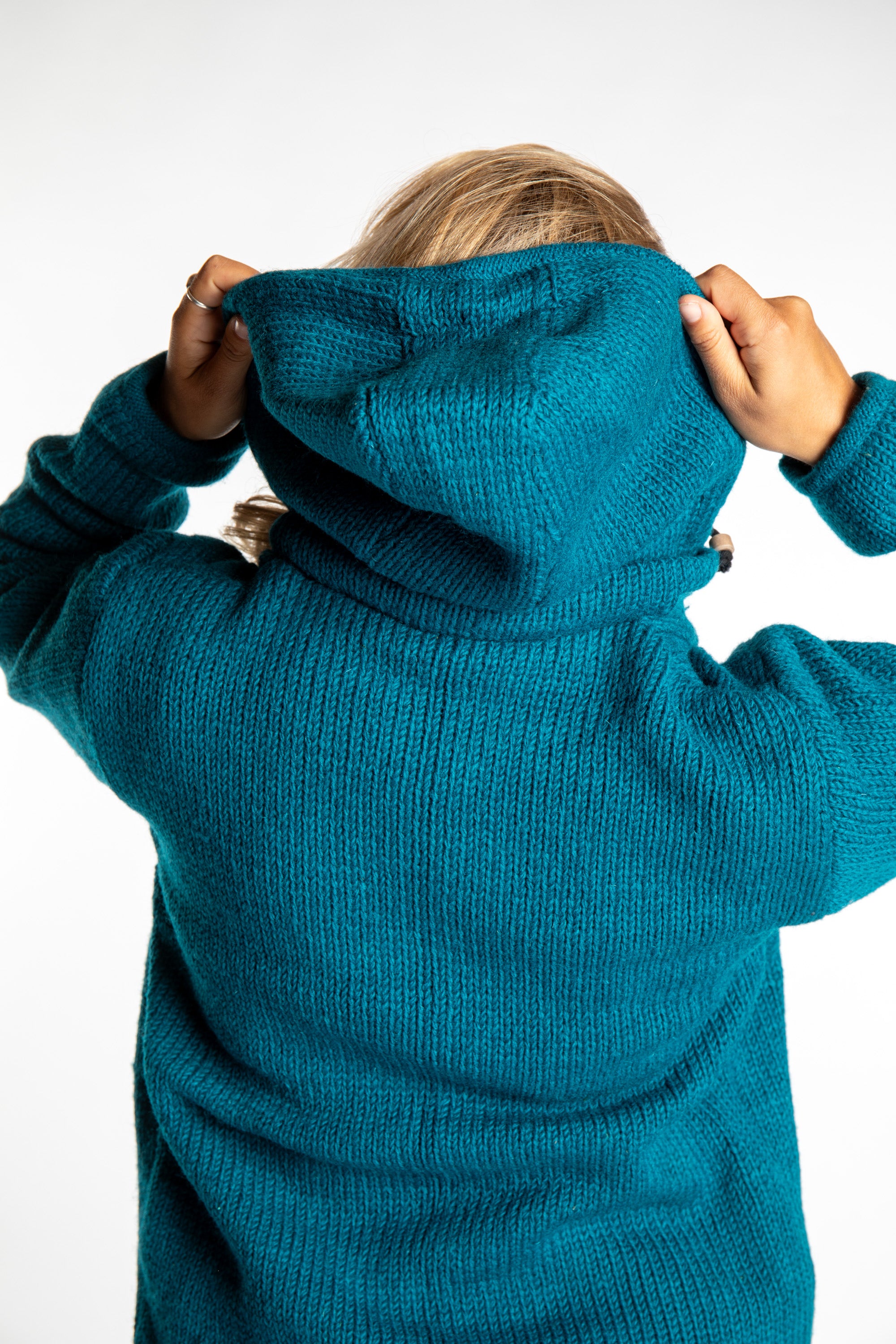 Sophie wearing size S Teal wool hoodie jacket