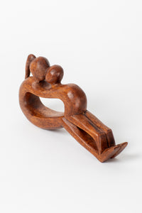 Wooden yoga sculpture in mother and child