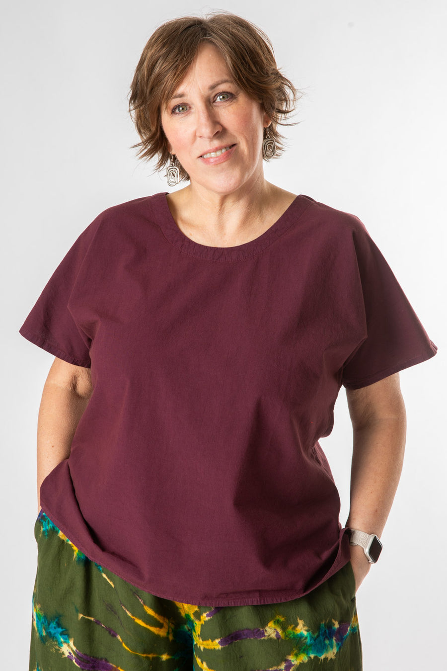 Betty is wearing a size L Purple tunic