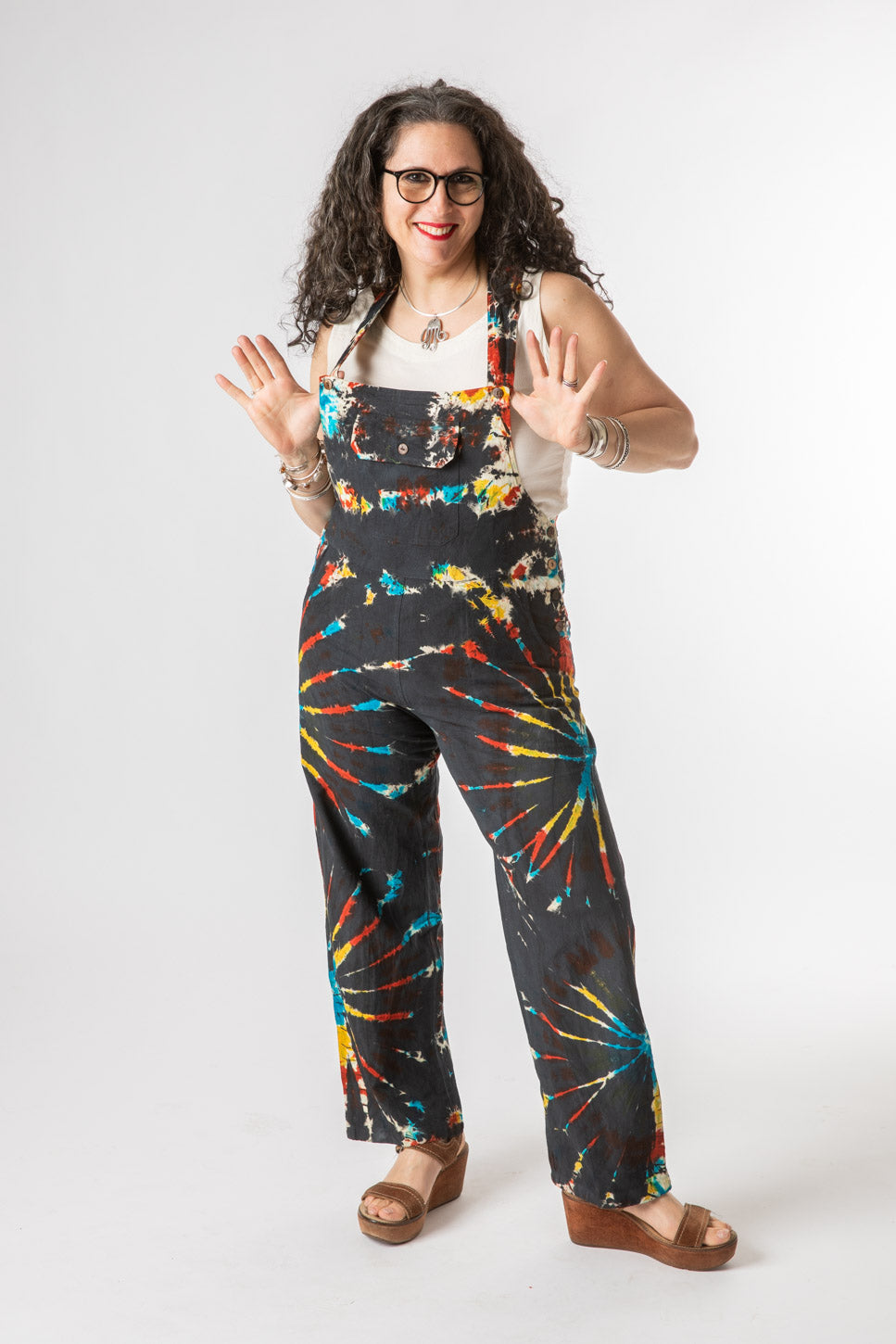 Susan is wearing size M tie dye overalls in black