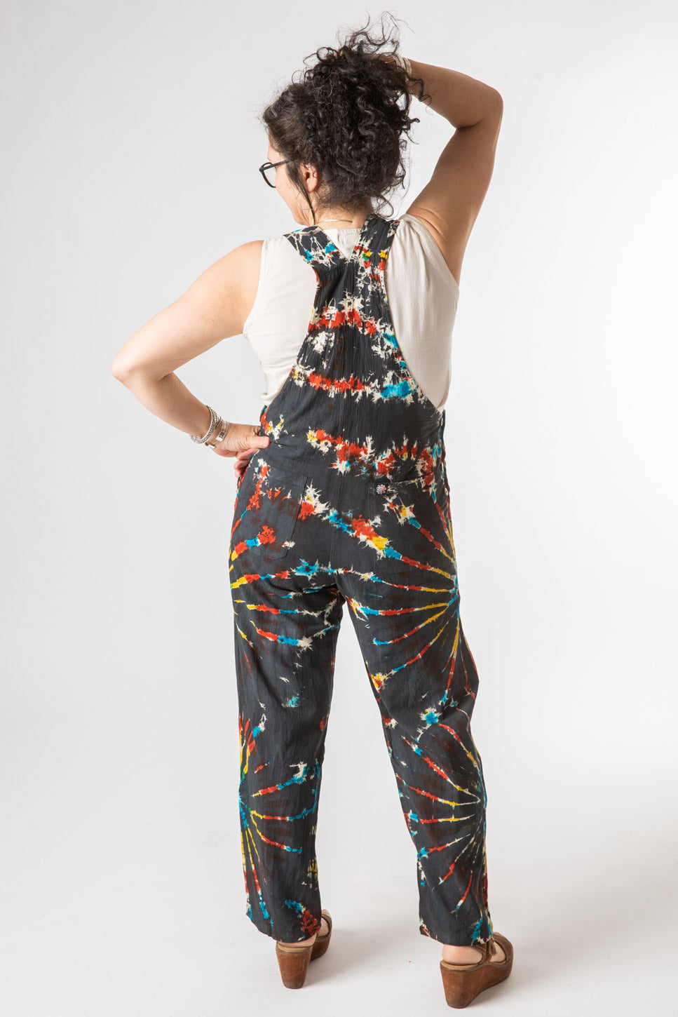 Susan is wearing size M tie dye overalls in black