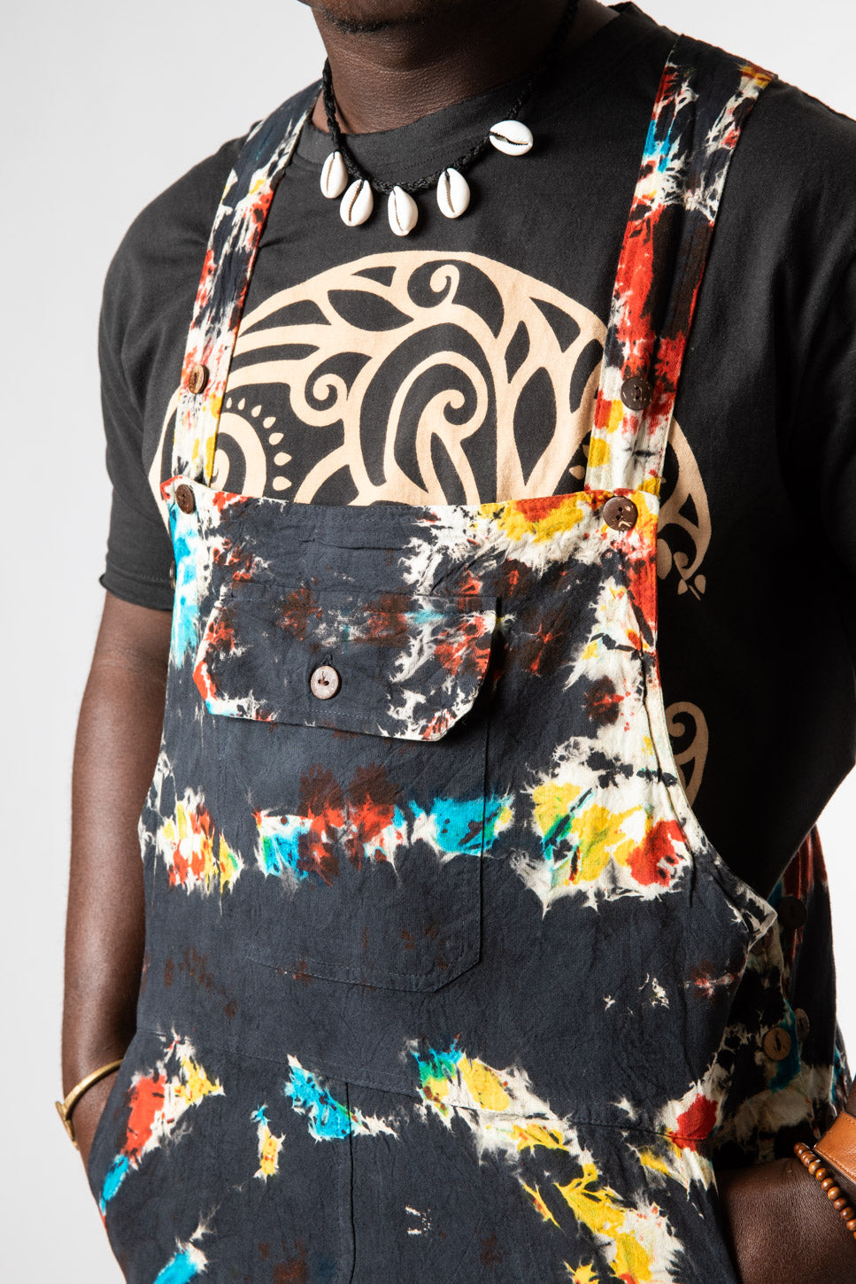 DJ is wearing size M tie dye overalls in black