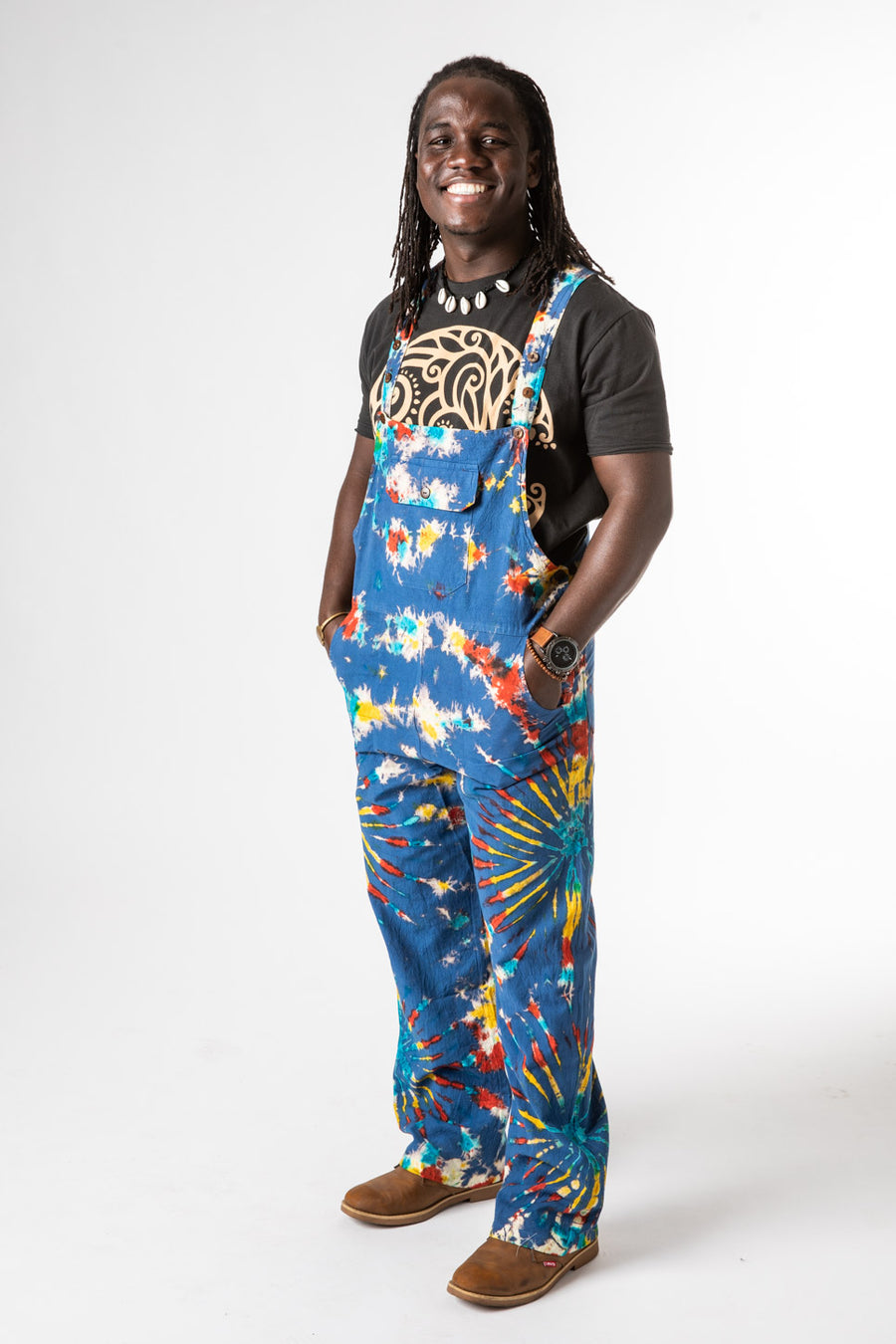 DJ is wearing size M tie dye overalls in blue