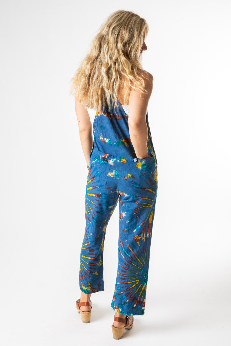 Sophie is wearing size S tie dye overalls in blue