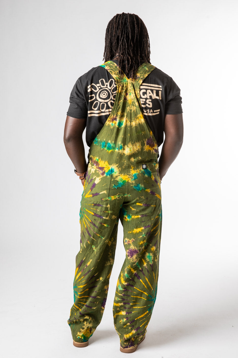 DJ is wearing size M tie dye overalls in green