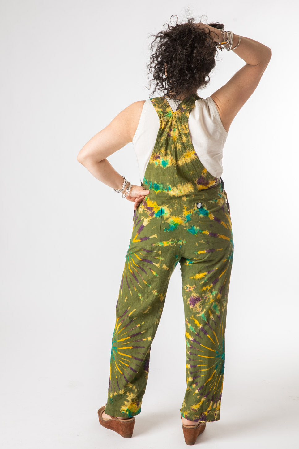 Susan is wearing size M tie dye overalls in green