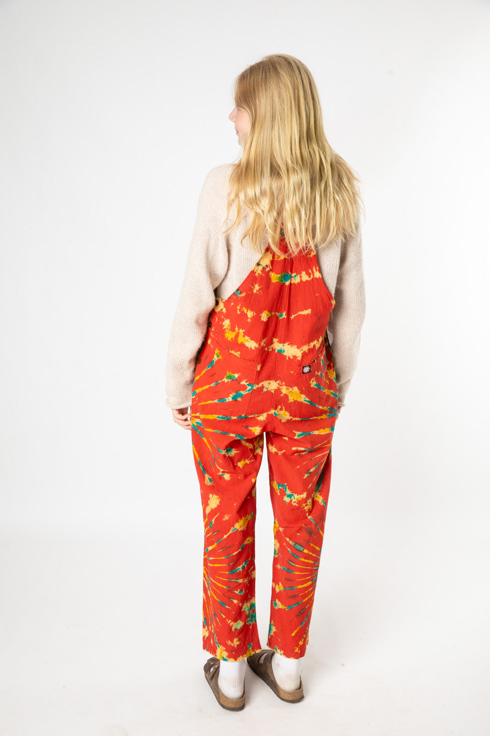 Misty is wearing size S tie dye overalls in red