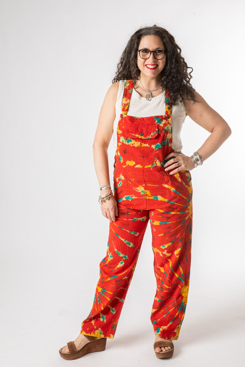 Susan is wearing size M tie dye overalls in red