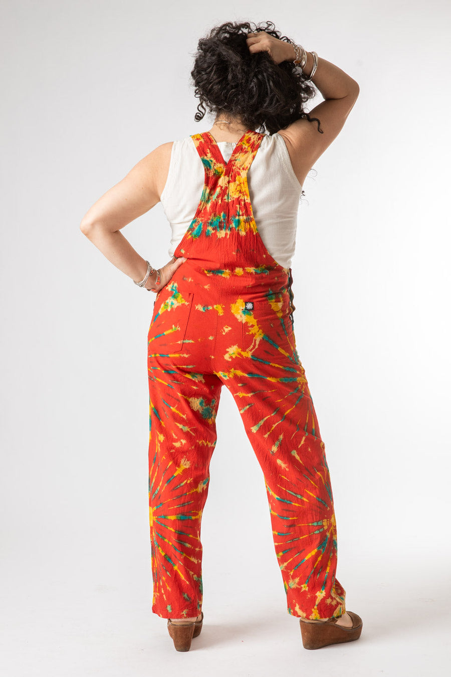 Susan is wearing size M tie dye overalls in red