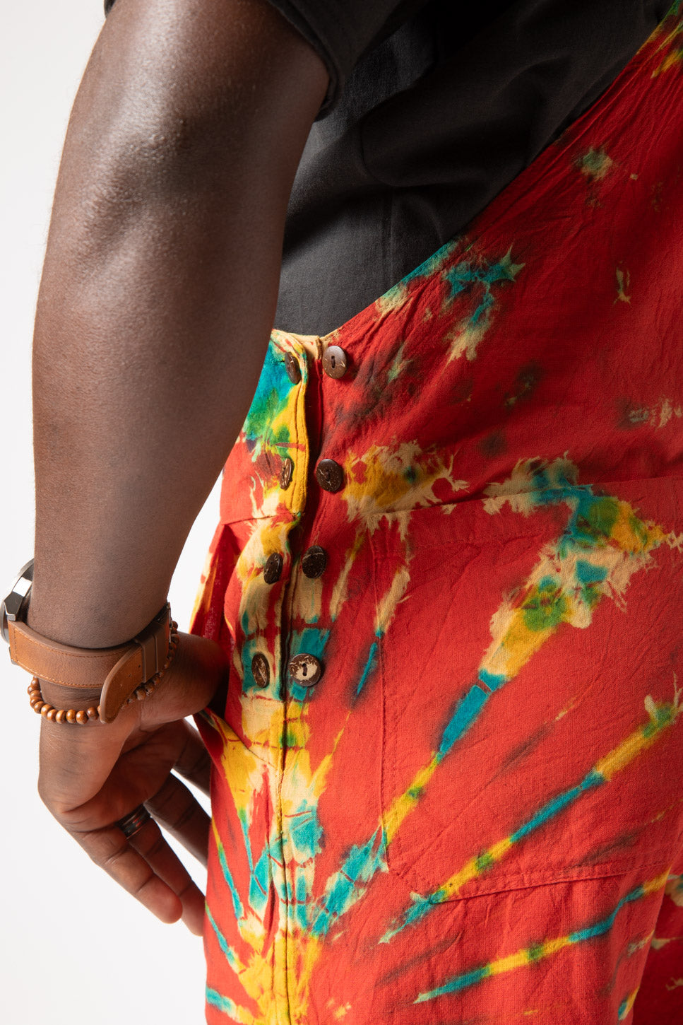 DJ is wearing size M tie dye overalls in red