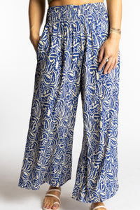 Sophie is wearing the S/M Blue Azure Canopy Printed Penny Lane Pants