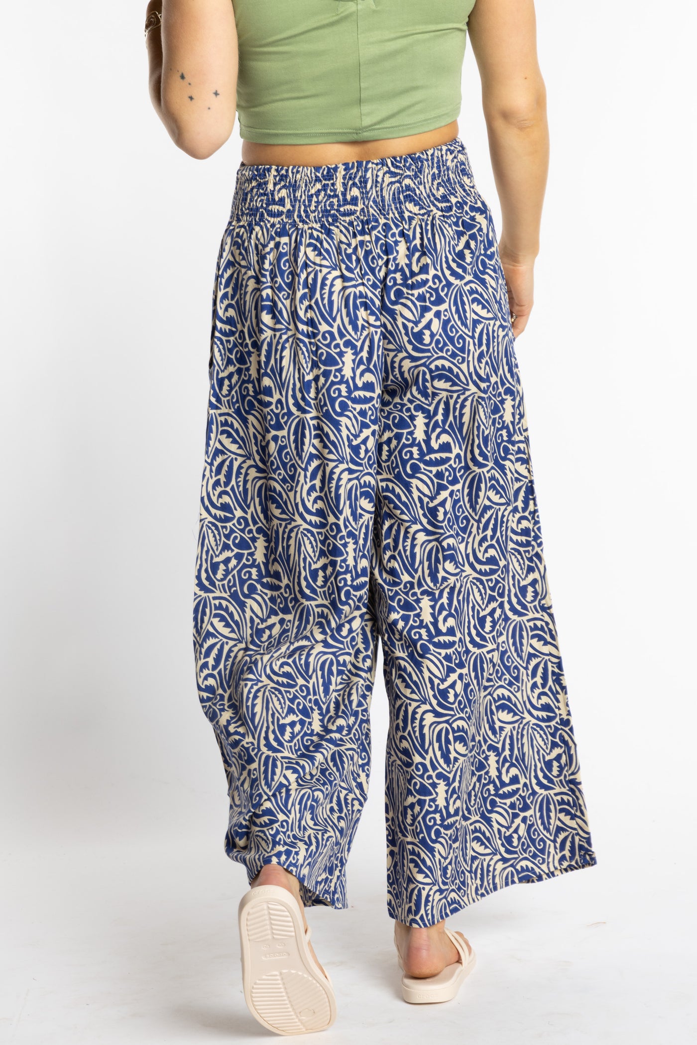Sophie is wearing the S/M Blue Azure Canopy Printed Penny Lane Pants