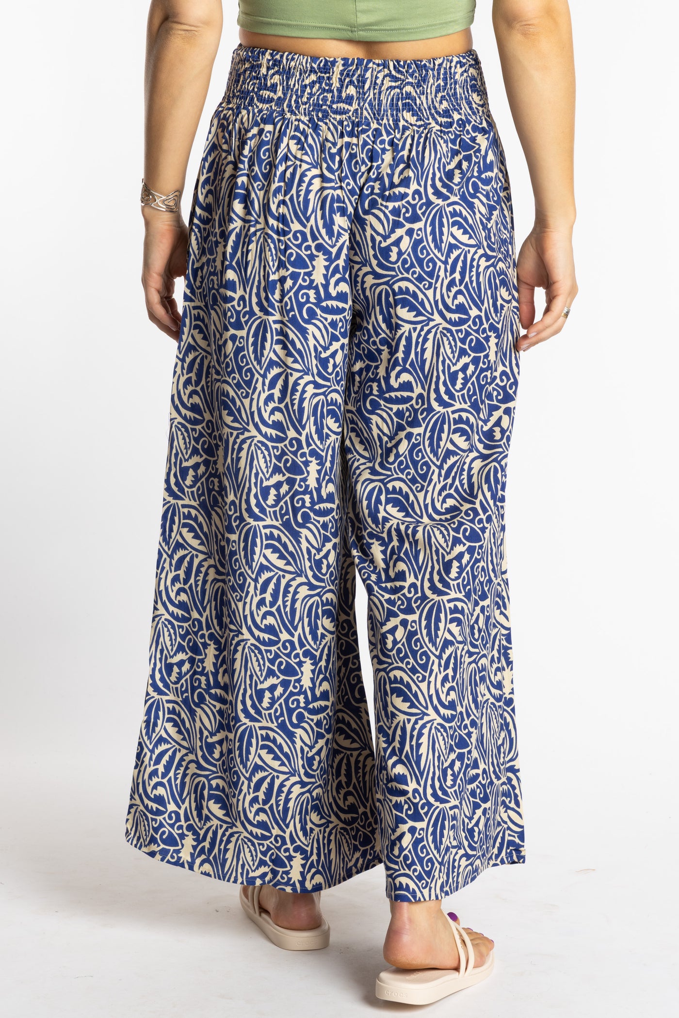 Sophie is wearing the S/M Blue Azure Canopy Printed Penny Lane Pants