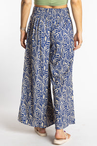 Sophie is wearing the S/M Blue Azure Canopy Printed Penny Lane Pants