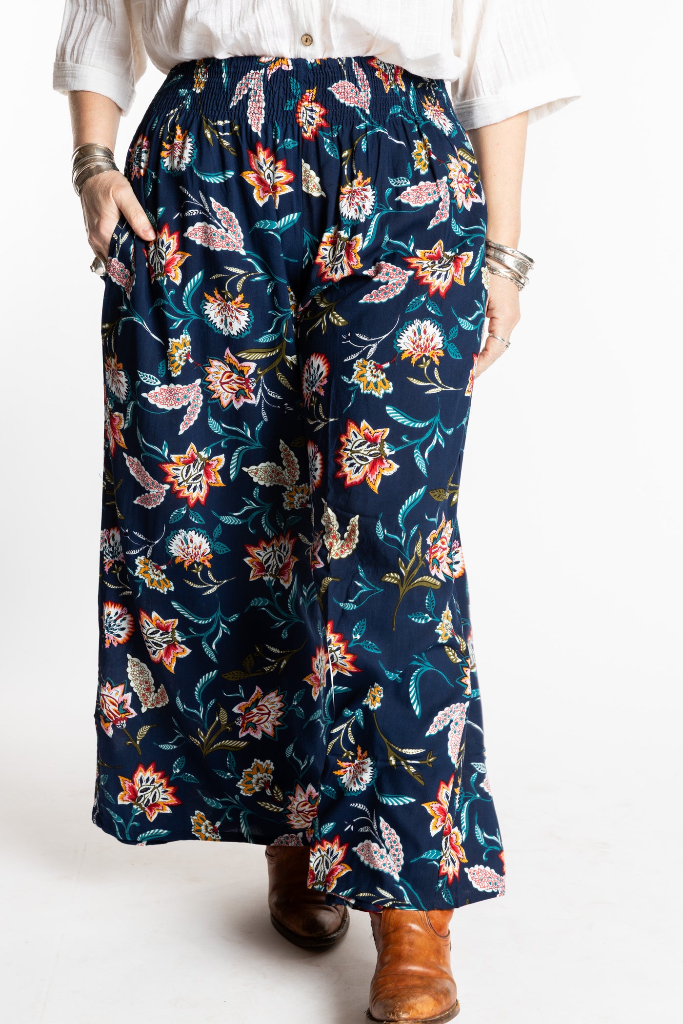 Susan is wearing the M/L Floral Blue Blooms Printed Penny Lane Pants