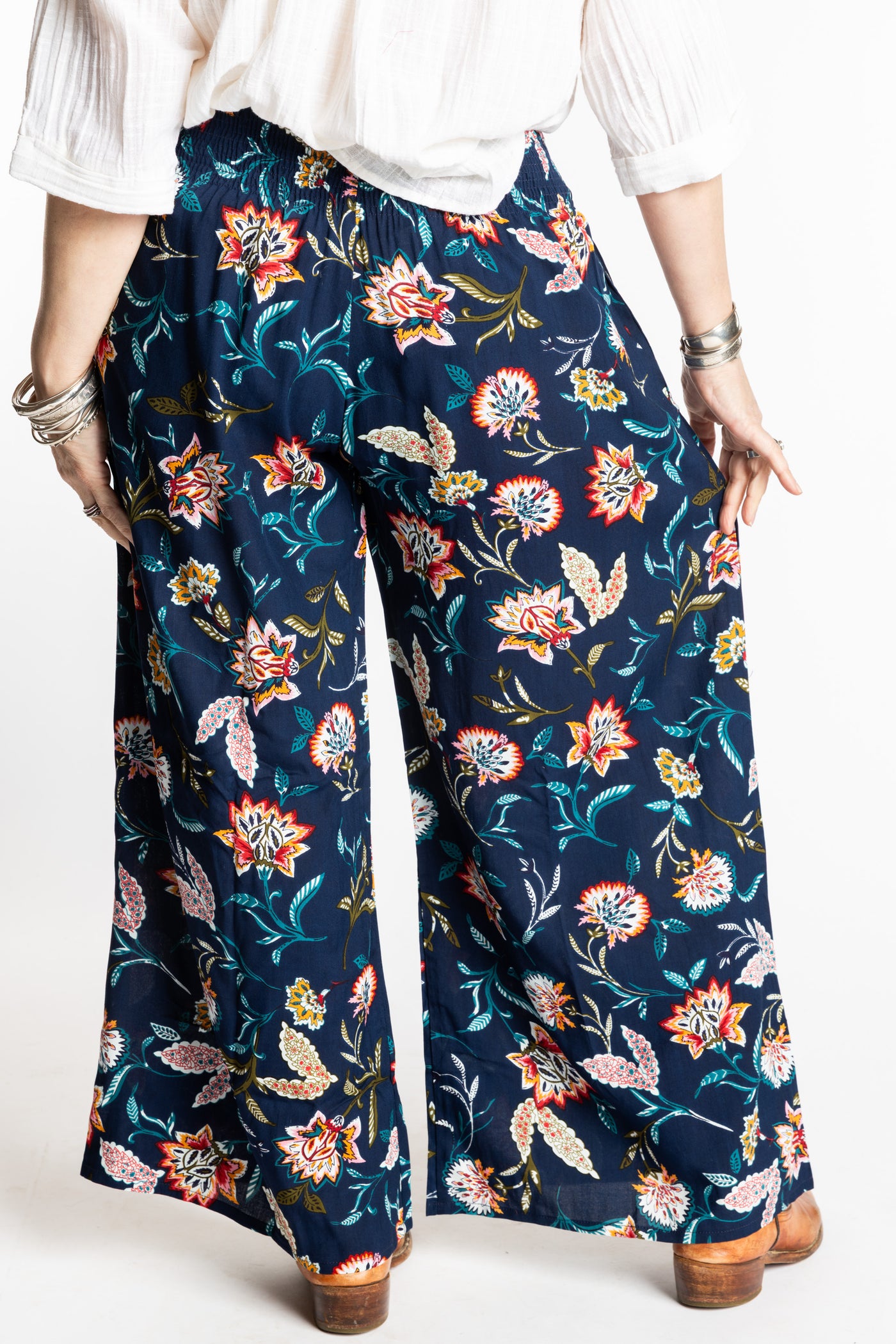 Susan is wearing the M/L Floral Blue Blooms Printed Penny Lane Pants