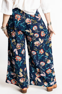 Susan is wearing the M/L Floral Blue Blooms Printed Penny Lane Pants
