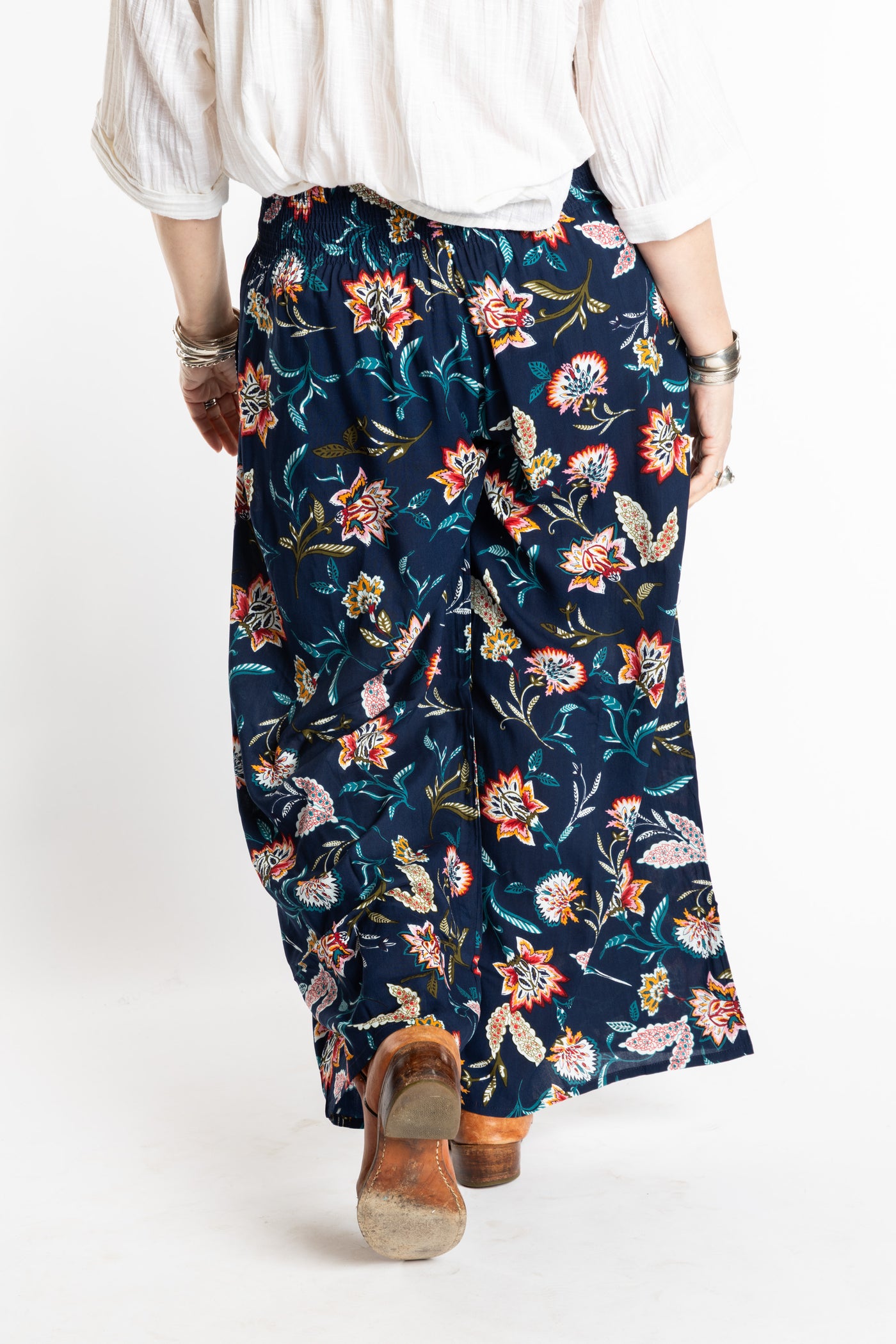 Susan is wearing the M/L Floral Blue Blooms Printed Penny Lane Pants
