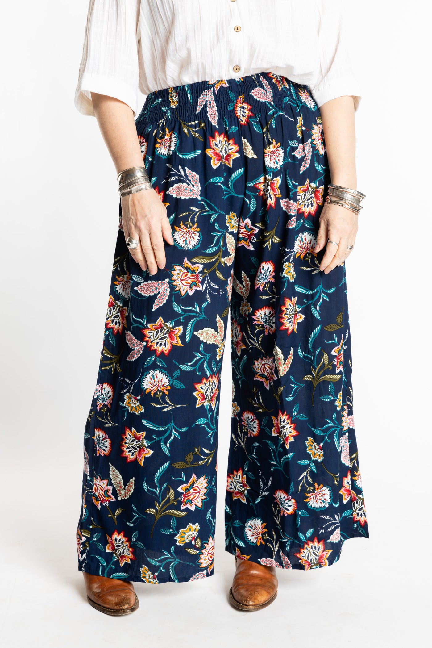 Susan is wearing the M/L Floral Blue Blooms Printed Penny Lane Pants