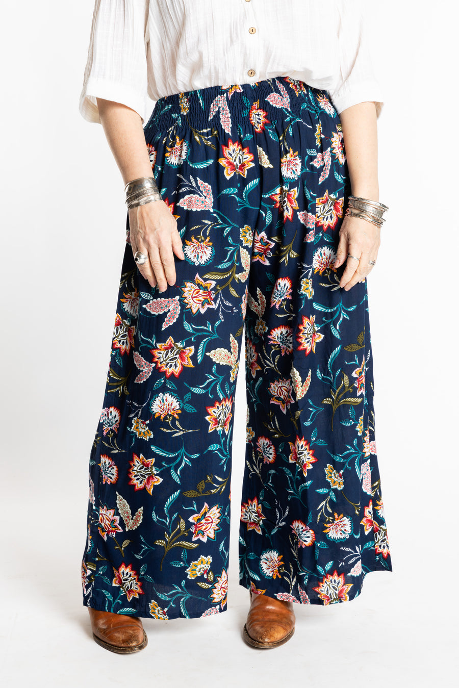 Susan is wearing the M/L Floral Blue Blooms Printed Penny Lane Pants
