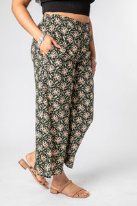Emily is wearing size S/M wide leg pants in midnight daisies