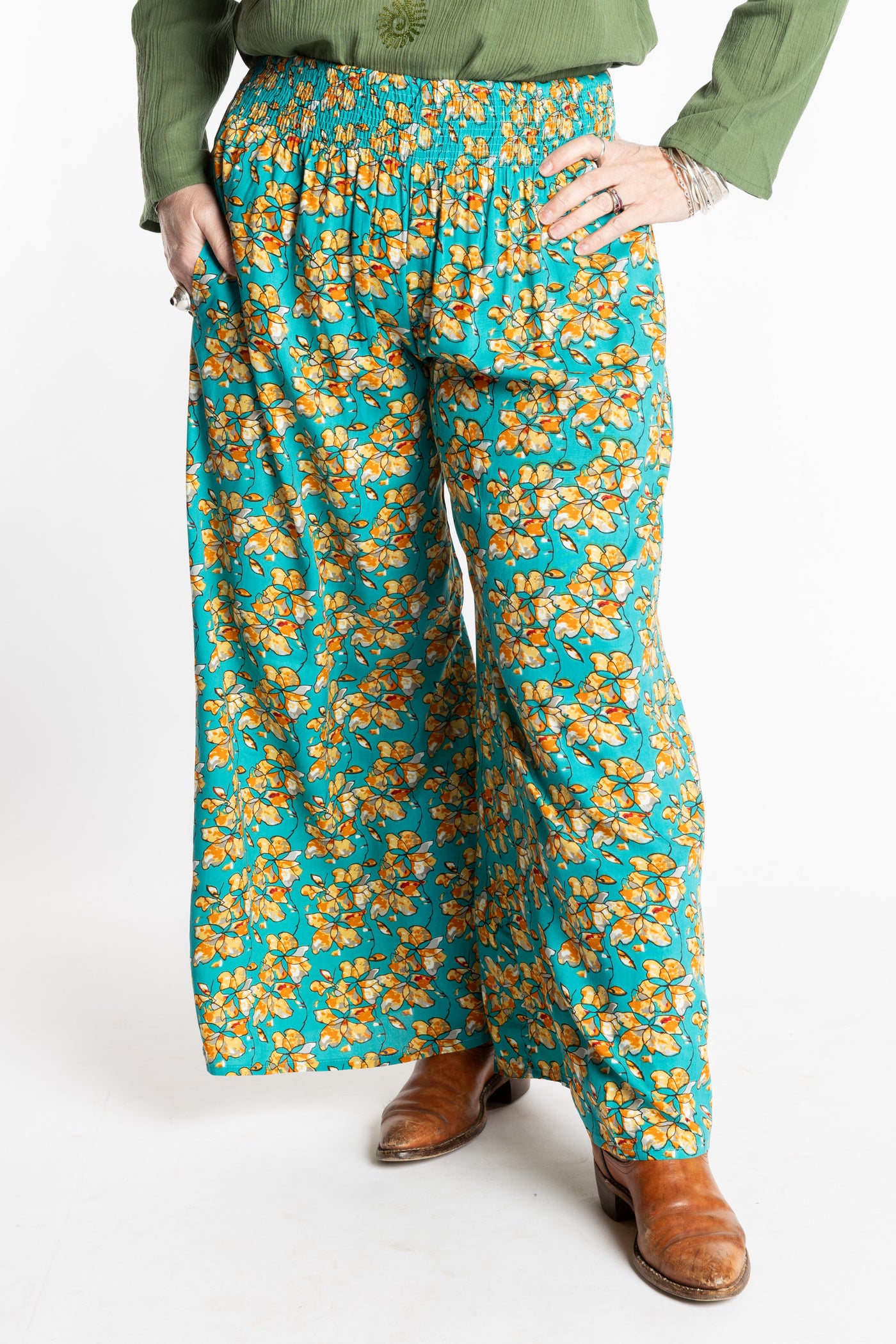 Susan is wearing the M/L Blue Floral Skyflower Printed Penny Lane Pants