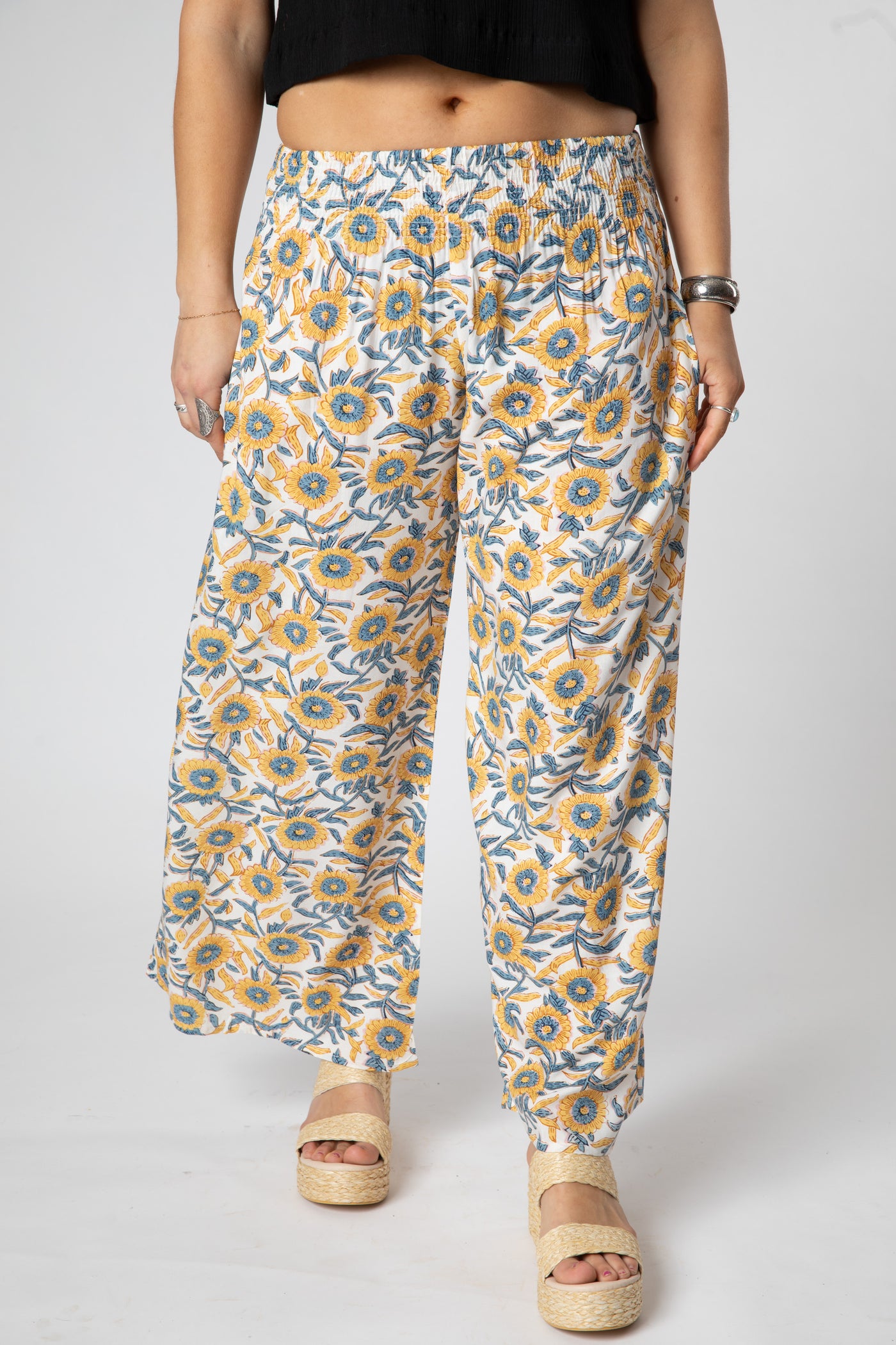 Sophie is wearing size S/M wide leg pants in sunflower