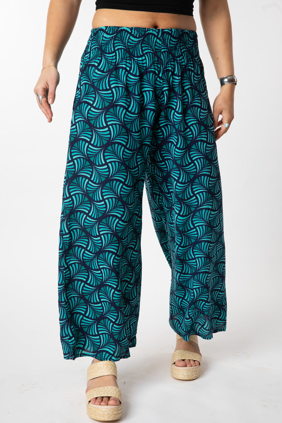 Sophie is wearing size S/M wide leg pants in turquoise fans