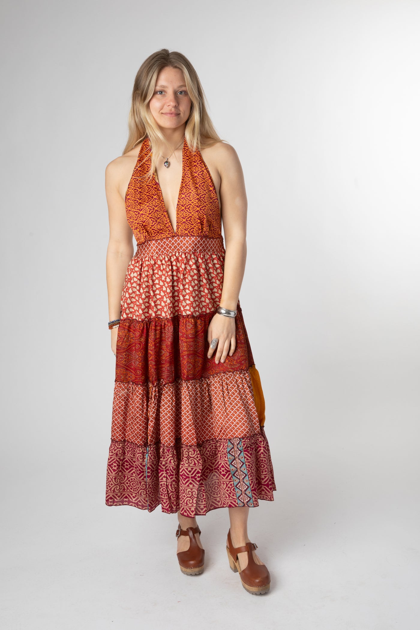 Sophie is wearing size S/M patchwork halter dress in fire on the mountain