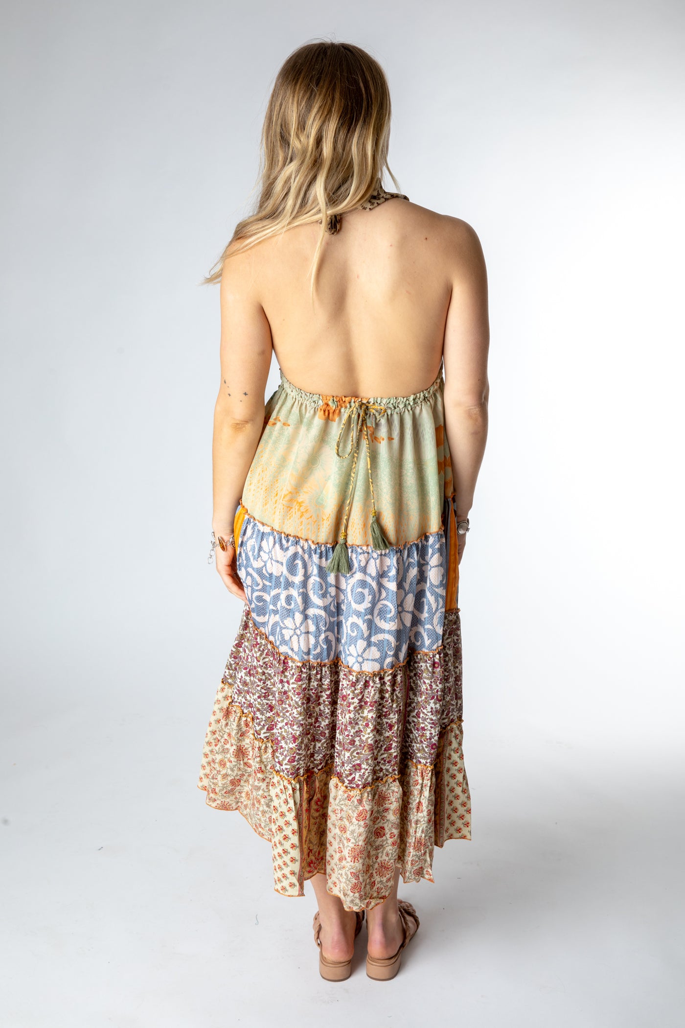 Sophie is wearing size S/M patchwork halter dress in jack straw