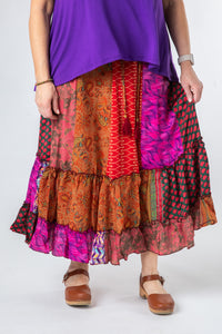 Betty is wearing a silk prairie skirt in dark star