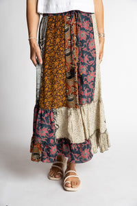 Sophie is wearing patchwork silk prairie skirt in dark star