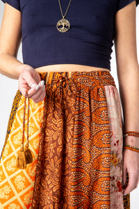 Emily is wearing a silk prairie skirt in fire on the mountain