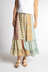 Sophie is wearing a mixed tan patchwork silk prairie skirt in jack straw