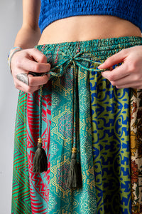 Colette is wearing a silk prairie skirt in morning dew