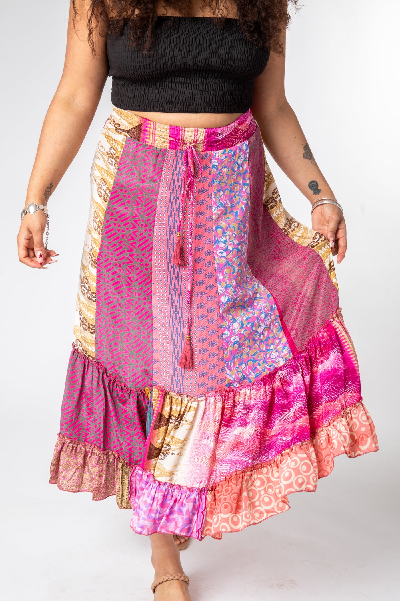 Lily is wearing a silk prairie skirt in sugar magnolia