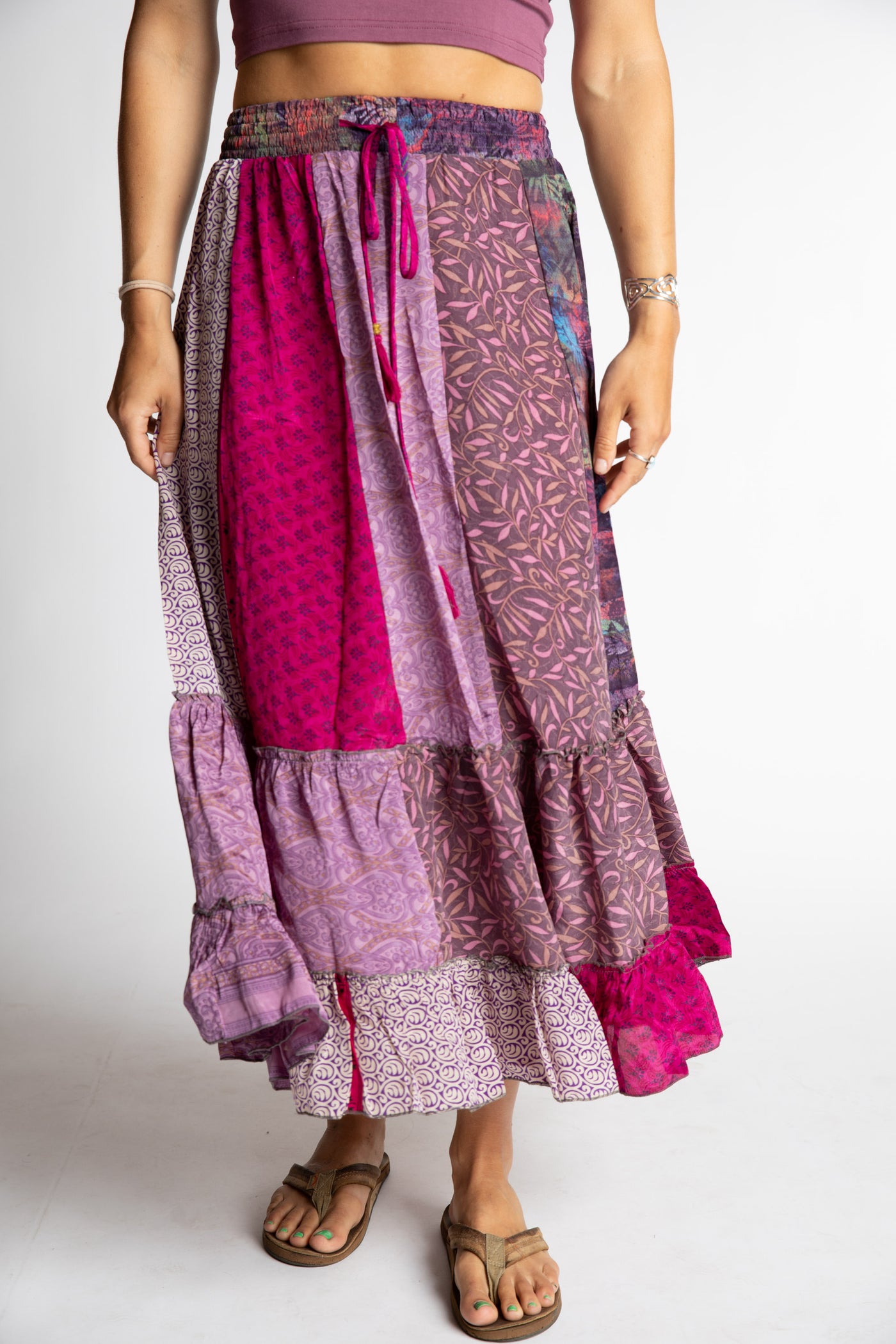 Sophie is wearing a pink and purple patchwork silk prairie skirt in sugar magnolia
