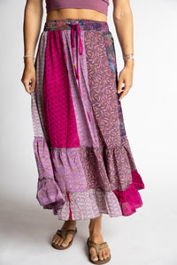 Sophie is wearing a pink and purple patchwork silk prairie skirt in sugar magnolia