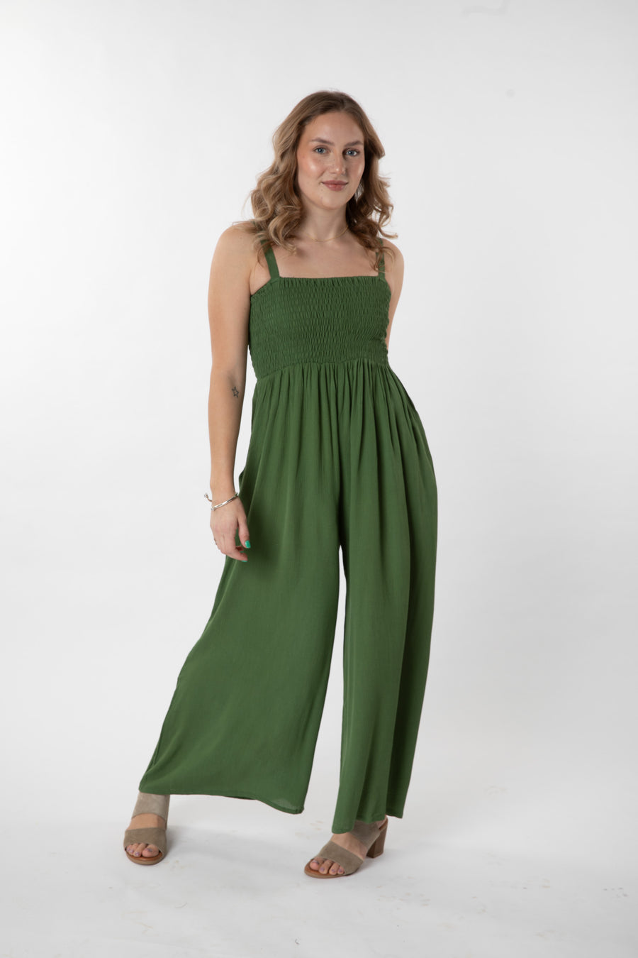 Jacalyn is wearing size S/M jumpsuit in fern 