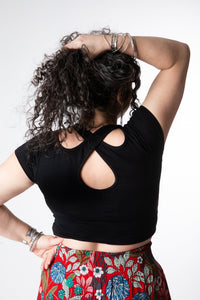 Susan is wearing size M cross back crop top in black