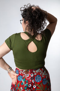 Susan is wearing size M cross back crop top in green