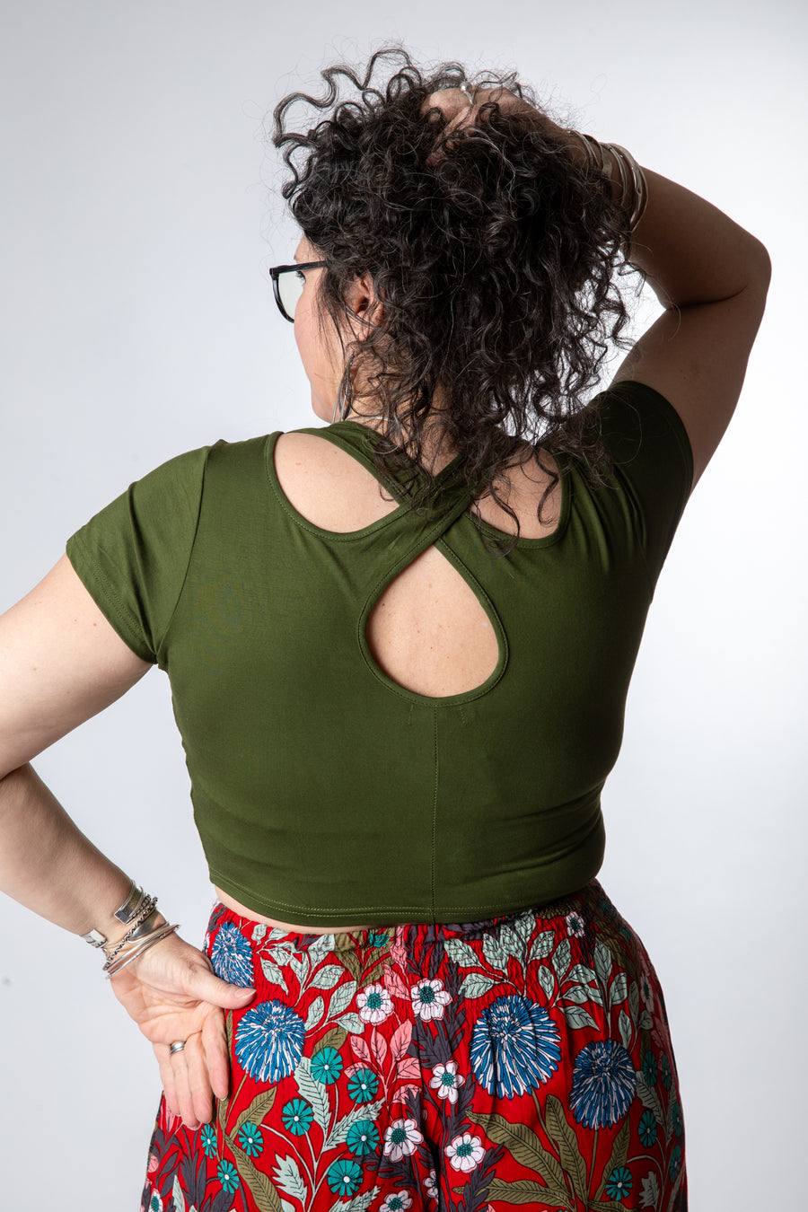 Susan is wearing size M cross back crop top in green