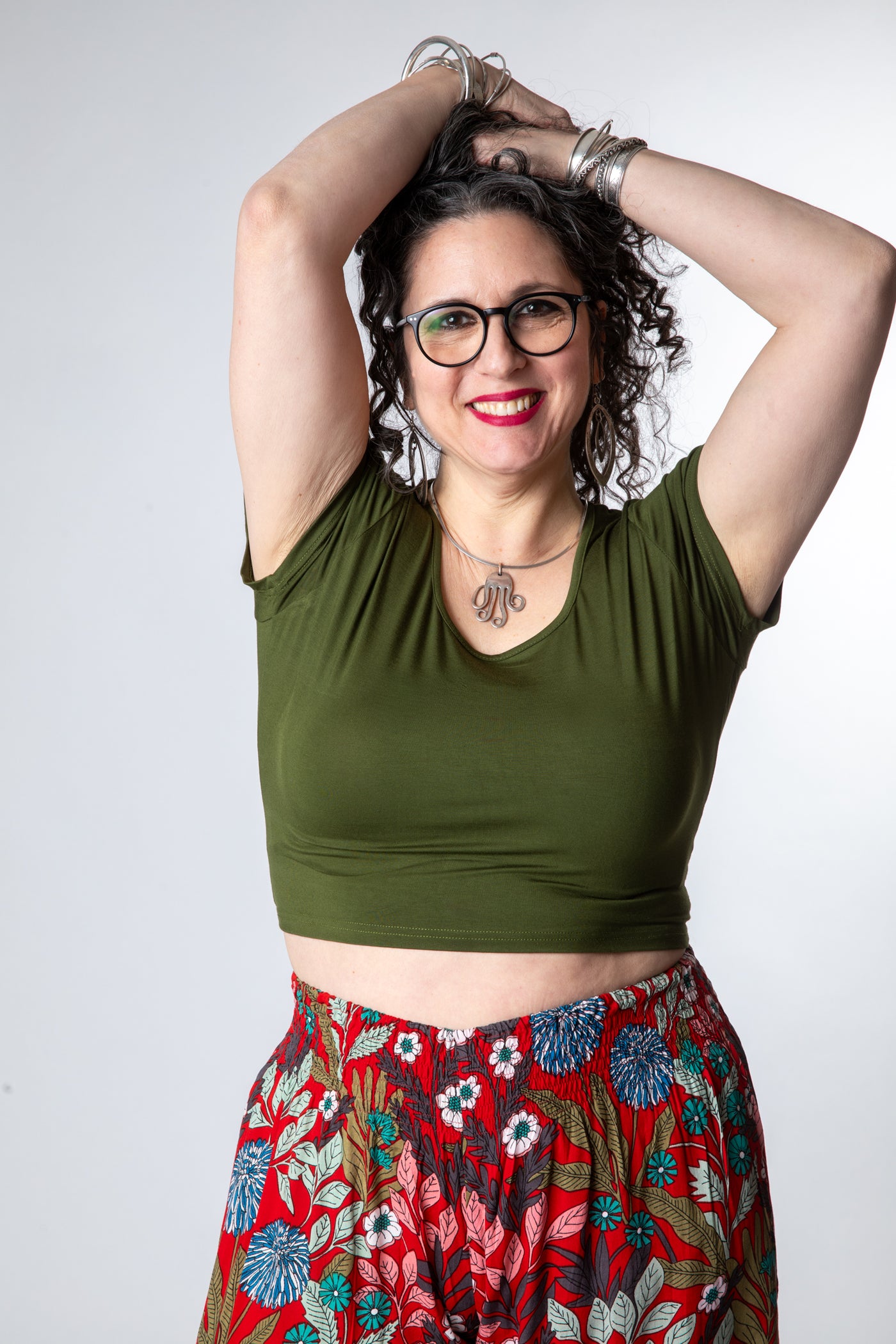 Susan is wearing size M cross back crop top in green