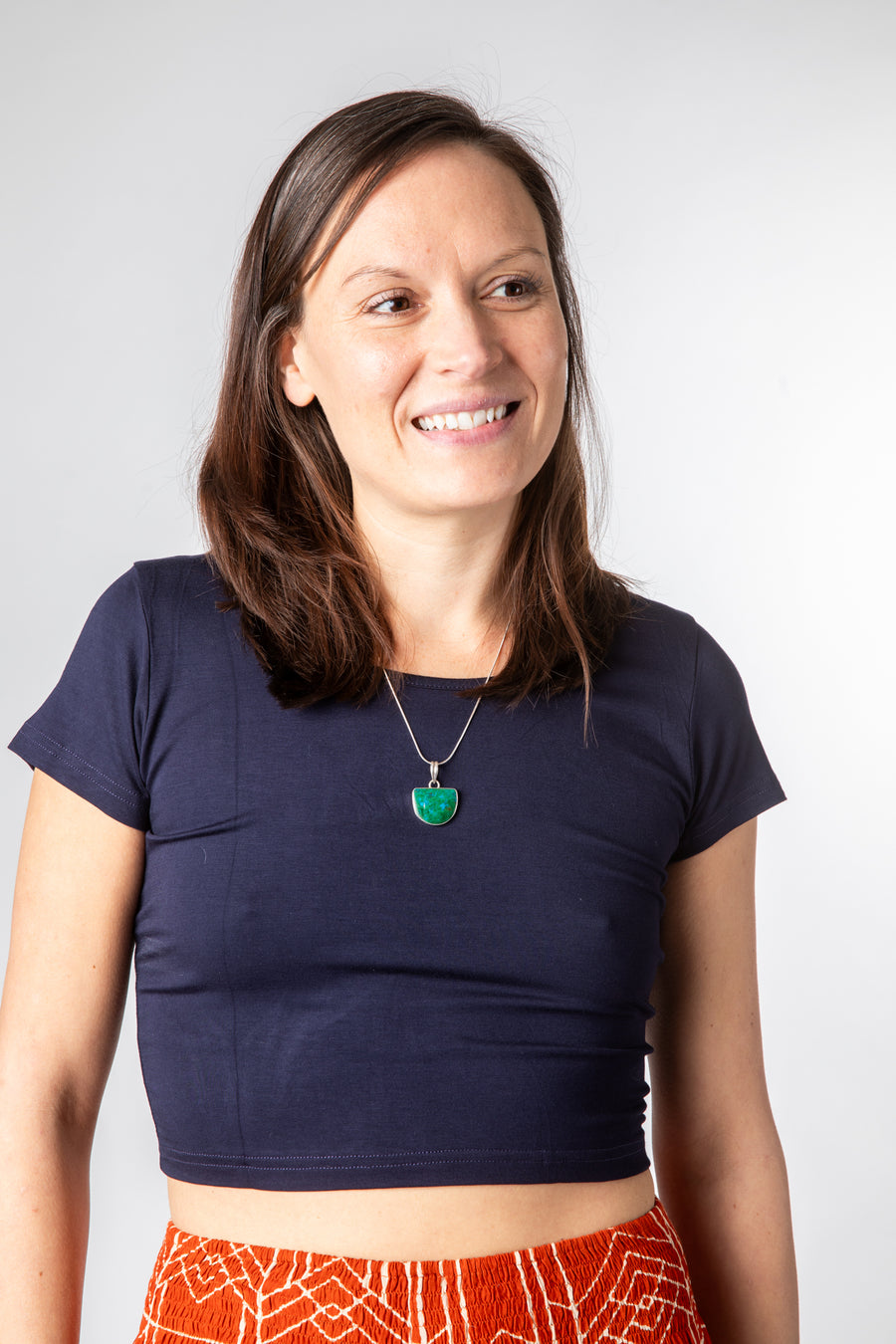 Emily is wearing size S cross back crop top in navy