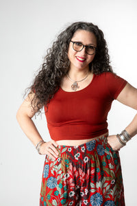 Susan is wearing size M cross back crop top in rust