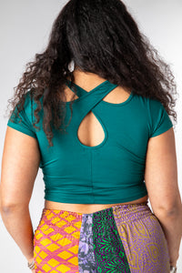 Lilly is wearing size M cross back crop top in teal