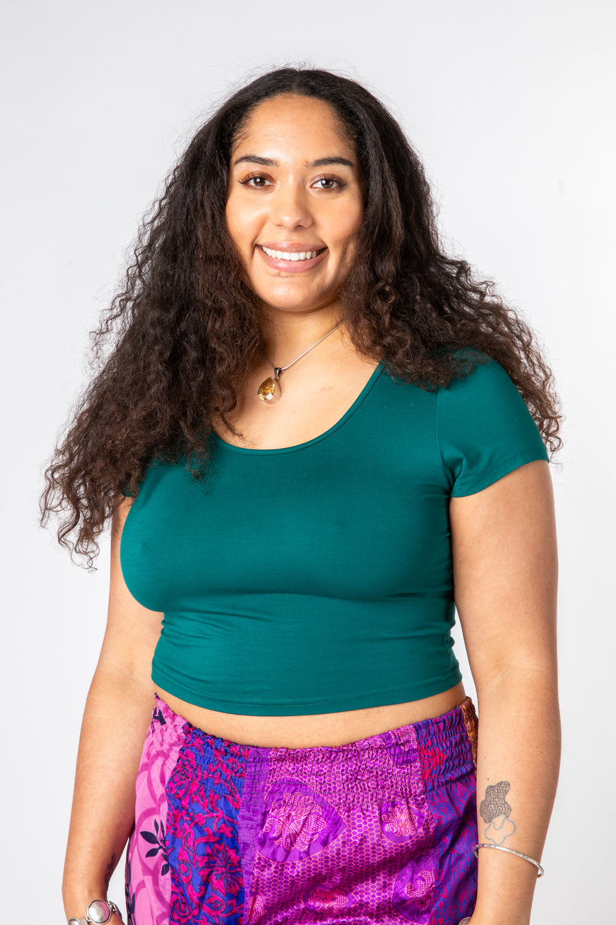 Lilly is wearing size M cross back crop top in teal