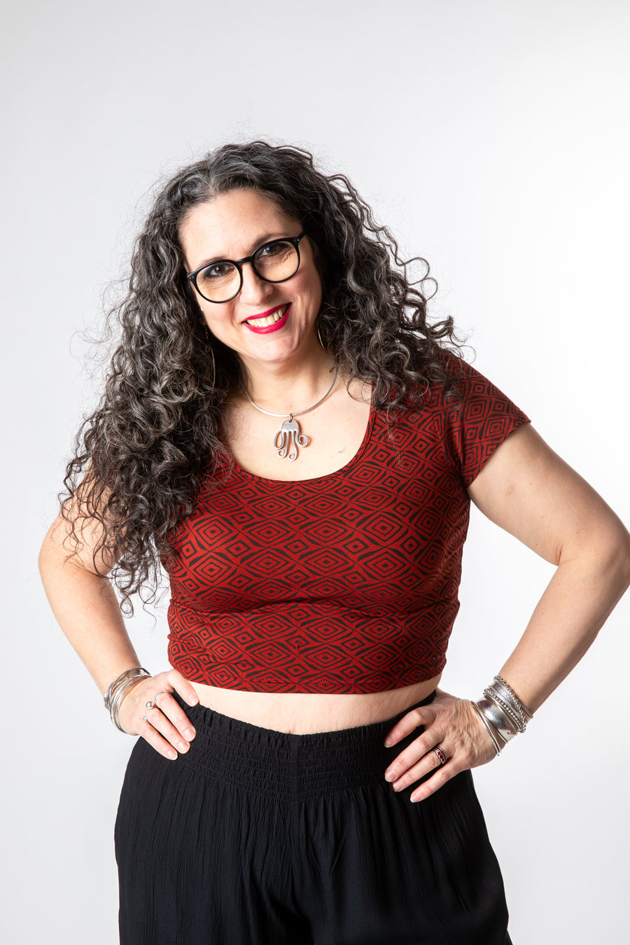 Susan is wearing size M cross back crop top in red diamonds