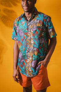 Ricardo is wearing size M printed cotton button up shirt in gray flora