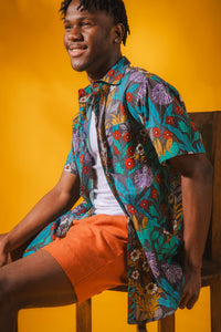 Ricardo is wearing size M printed cotton button up shirt in gray flora